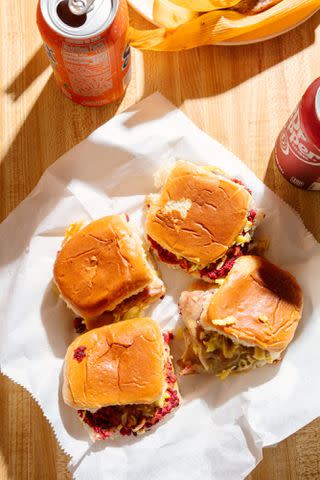 Cedric Angeles The fire red “smokes” sliders at Big Apple Inn are made with Red Rose brand sausage.