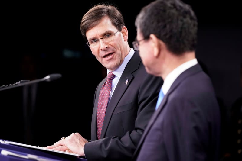 U.S. Secretary of Defense Mark Esper speaks next to Japan's Defense Minister Taro Kono during a joint news conference at the Pentagon in Washington