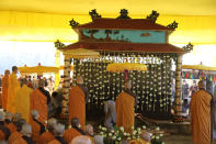 Buddhist monks attend the cremation of Vietnamese Buddhist monk Thich Nhat Hanh in Hue, Vietnam Saturday, Jan. 29, 2022. A funeral was held Saturday for Thich Nhat Hanh, a week after the renowned Zen master died at the age of 95 in Hue in central Vietnam. (AP Photo/Thanh Vo)