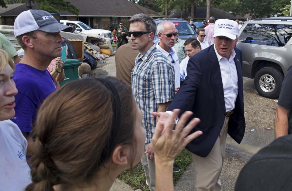 Republican presidential candidate Donald Trump greets flood victims during a tour of flood-damaged homes in Denham Springs, La., on Aug. 19. (Photo: Max Becherer/AP)