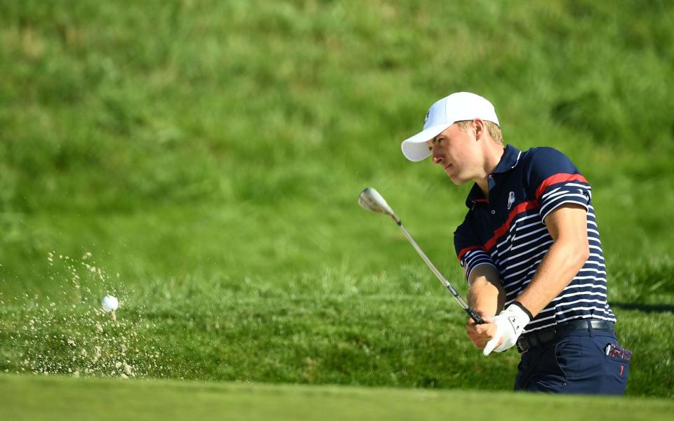 US golfer Jordan Spieth plays a shot out of a bunker during a practice session ahead of the 42nd Ryder Cup - AFP