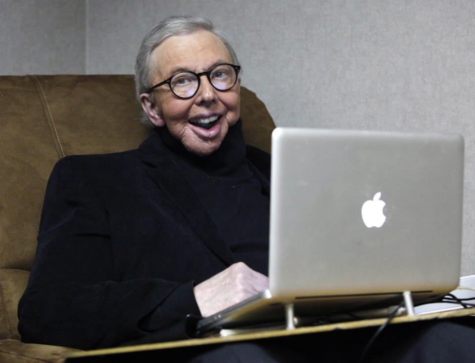 FILE - In this Jan. 12, 2011 file photo, film critic Roger Ebert works in his office at the WTTW-TV studios in Chicago. When "Life Itself" debuts Sunday, Jan. 19, 2014, at the Sundance Film Festival it will be the first time Ebert's wife, Chaz, will see the full documentary about her late husband's life. "Life Itself" includes footage that director Steve James gathered over the final four months before the famed film critic died last April after a long battle with cancer. (AP Photo/Charles Rex Arbogast, File)