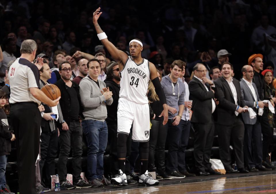 Brooklyn Nets' Paul Pierce (34) gestures to the crowd during the first half of Game 3 of an NBA basketball first-round playoff series against the Toronto Raptors on Friday, April 25, 2014, in New York. (AP Photo/Frank Franklin II)