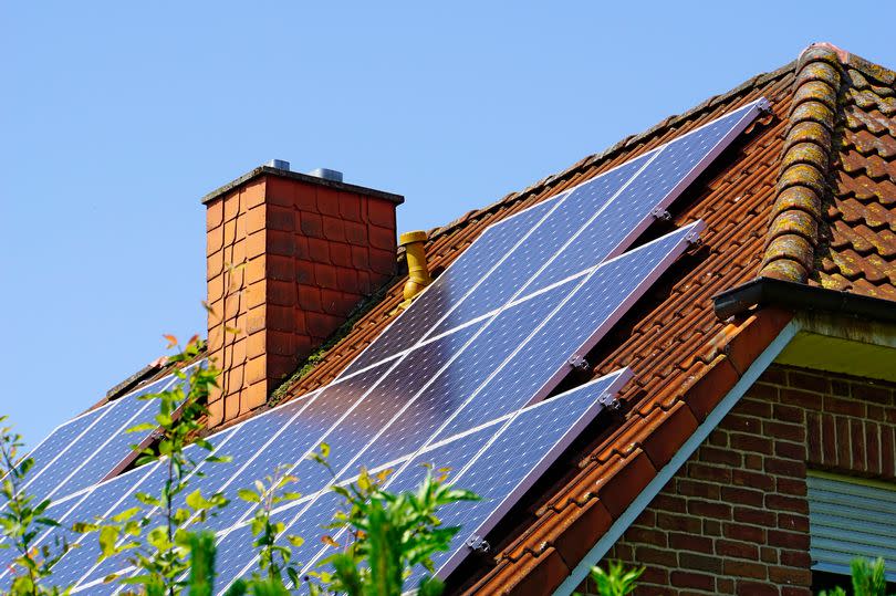 A solar panel on a house's roof