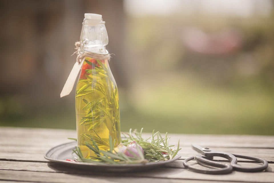 a sprayer bottle with rosemary in it