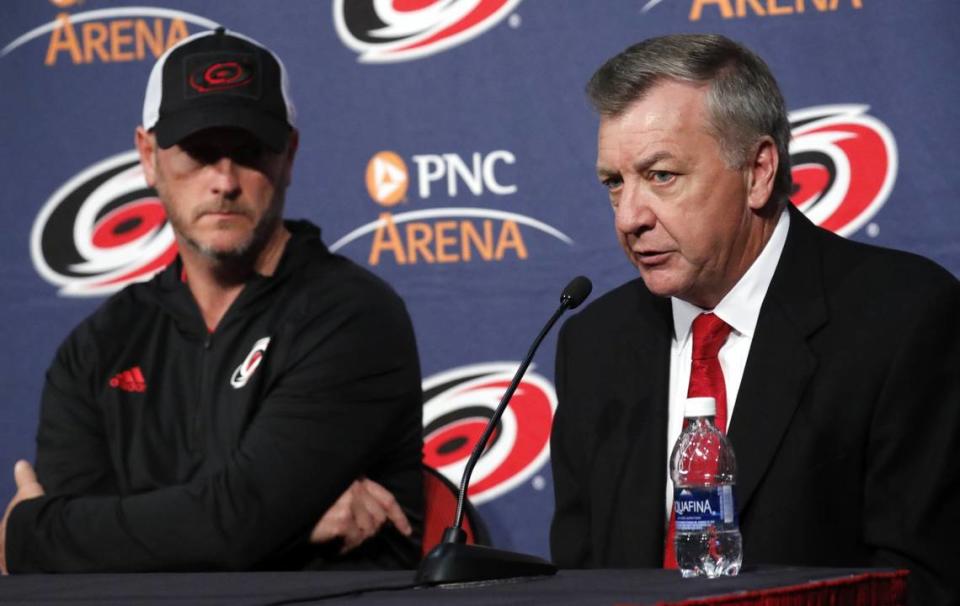 Majority owner Tom Dundon, left, looks on as Don Waddell speaks to reporters after it was announced he would be the team’s new general manager, a position he has held in the interim since Ron Francis’ departure several weeks ago, during a press conference held at PNC Arena in Raleigh on May 9, 2018. It was also announced that former star player and assistant coach Rod Brind’Amour would be the team’s new head coach.