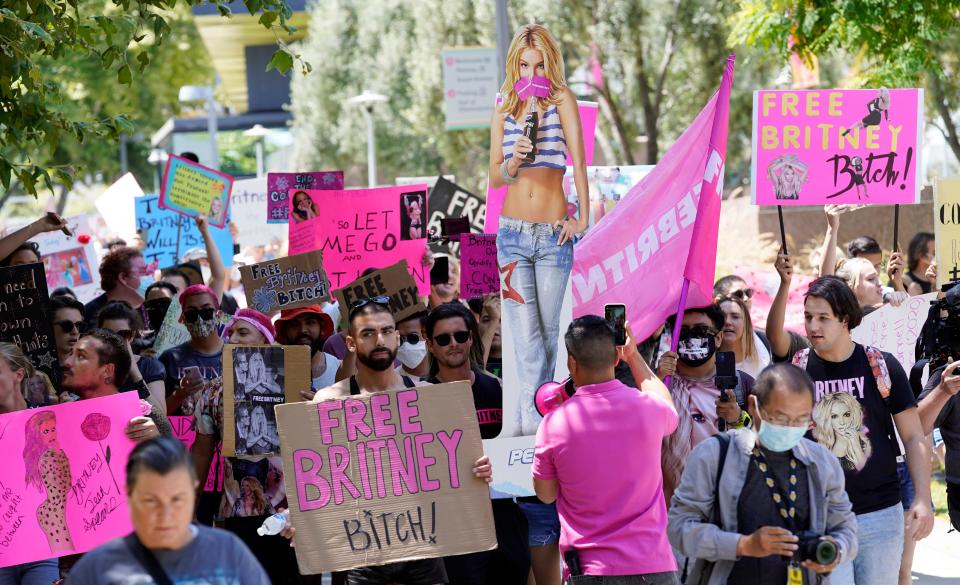 Britney Spears supporters march outside a court hearing concerning the pop singer's conservatorship at the Stanley Mosk Courthouse, Wednesday, June 23, 2021, in Los Angeles. Spears appeared in court on Wednesday to lobby against being under her current conservator, under her father Jamie Spears. 