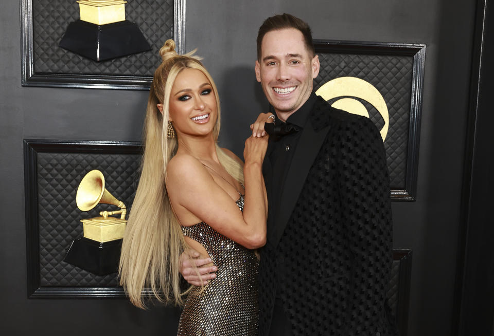 <p>For one of their first red carpet appearances since welcoming a son together, Paris Hilton and Carter Reum brought their style A-game. The DJ and businesswoman dazzled in a reflective, jewel-covered gown, while the new dad wore an all-black textured suit.</p>