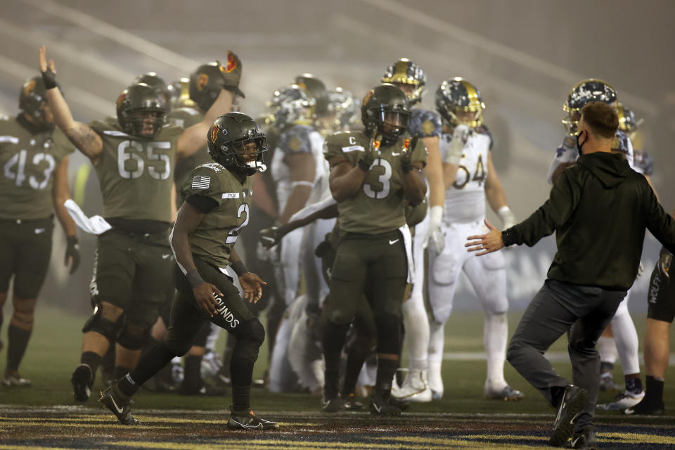 Army quarterback Tyhier Tyler celebrates after defeating Navy in an NCAA college football game Saturday, Dec. 12, 2020, in West Point, N.Y.  (AP Photo/Adam Hunger)