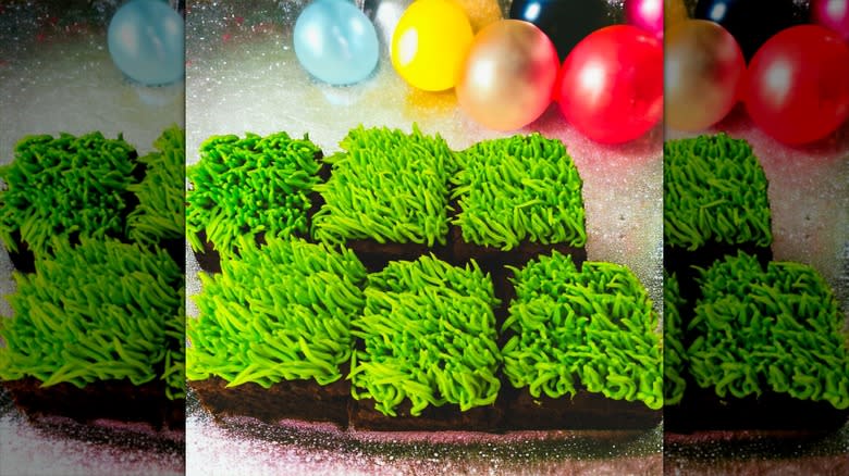 cake frosted using a grass tip