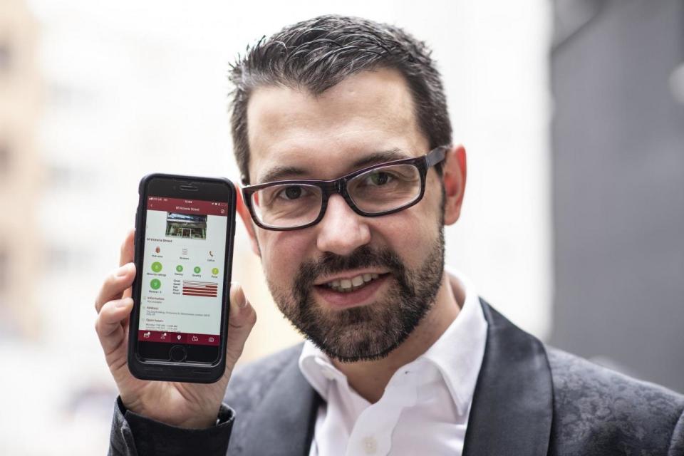 Sommelier Julien Sahut with his 'Wine Picker' app (Daniel Hambury/@stellapicsltd)