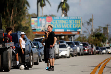 Local residents wait for the reopening of the entry road for the Florida Keys road after Hurricane Irma strikes Florida, in Homestead, Florida, U.S., September 11, 2017. REUTERS/Carlos Barria