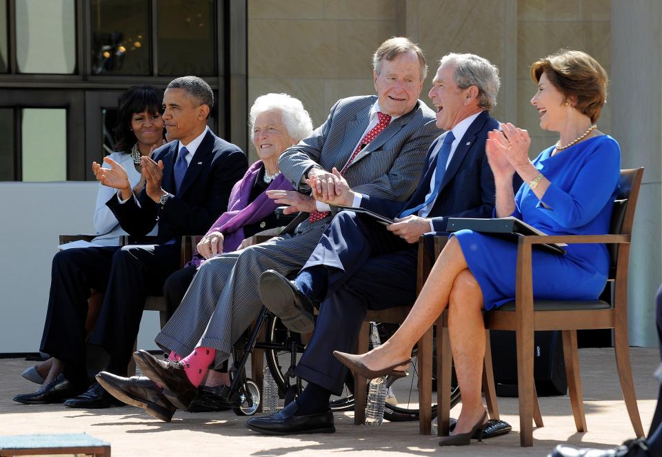 Three former presidents and first ladies: from left, Michelle Obama, Barack Obama, Barbara Bush, George H.W. Bush, George W. Bush, and Laura Bush; the occasion was a speech by George H.W. Bush — wearing bright red socks that matched his tie — at the George W. Bush Presidential Center dedication ceremony in Dallas on April 25, 2013. (Photo: Jewel Samad/AFP/Getty Images)