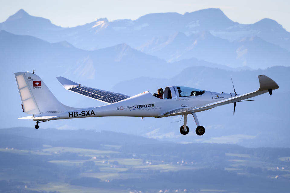 SolarStratos solar powered aircraft prototype flies with Swiss adventurer Raphael Domjan and Spanish test pilot Miguel A. Iturmendi aboard during a test flight and attempt to break two world records at the airbase in Payerne, Switzerland, Tuesday, Aug. 25, 2020. Two world record were made during today's test flight, the first jump in history from an electric aircraft exclusively charged with solar energy and the first solar free fall. The main objective of the SolarStratos Mission project is to be the first solar flight to achieve stratospheric flight. (Laurent Gillieron/Keystone via AP)