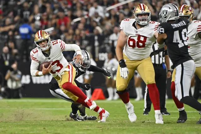 San Francisco 49ers quarterback Brock Purdy (13) runs with the ball against the Las Vegas Raiders during the first half of an NFL preseason football game, Friday, Aug. 23, 2024, in Las Vegas. (AP Photo/David Becker)