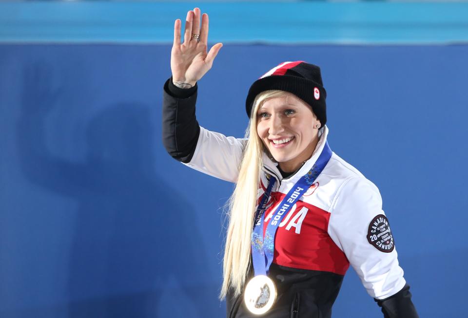 In this February 20, 2014 file photo, Canada’s gold medallist bobsleigh pilot Kaillie Humphries waves to the crowd during the Women’s Bobsleigh Medal Ceremony at the Sochi medals plaza during the Sochi Winter Olympics. (AFP Photo/LOIC VENANCE)