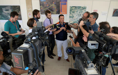 Flavio Godinho, the Civil Defense Agency Lieutenant, talks with journalists in an area near the dam at Brazilian miner Vale's Gongo Soco mine, amid reports that it may soon collapse, in Barao de Cocais, Minas Gerais state, Brazil May 24, 2019. REUTERS/Washington Alves