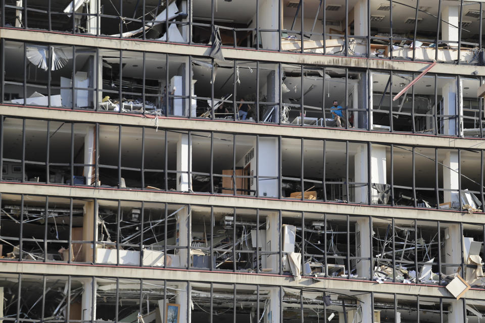 A damaged building is seen after a massive explosion in Beirut, Lebanon, Wednesday, Aug. 5, 2020. Massive explosions rocked downtown Beirut on Tuesday, flattening much of the port, damaging buildings and blowing out windows and doors as a giant mushroom cloud rose above the capital. Witnesses saw many people injured by flying glass and debris. (AP Photo/Hassan Ammar)