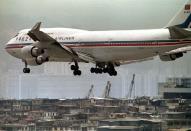 FILE PHOTO: A China Airlines 747-400 prepares to land over buildings at Hong Kong's Kai Tak international airpor..
