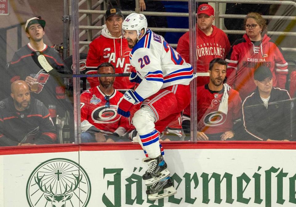 New York Rangers left wing Chris Kreider (20) crashes into the boards as he celebrates after scoring in the second period to tie the Carolina Hurricanes 1-1 in the second period of Game 3 in the second round of the 2024 Stanley Cup playoffs on Thursday, May 9, 2024 at PNC Arena, in Raleigh N.C.