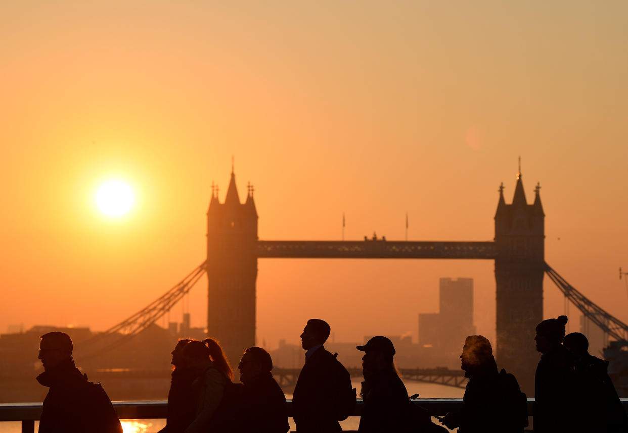 Workers cross London Bridge, with Tower Bridge seen behind during the morning rush hour in the city of London, Britain, February 27, 2019. REUTERS/Toby Melville