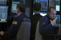 Traders work on the floor of the New York Stock Exchange February 12, 2014. REUTERS/Brendan McDermid