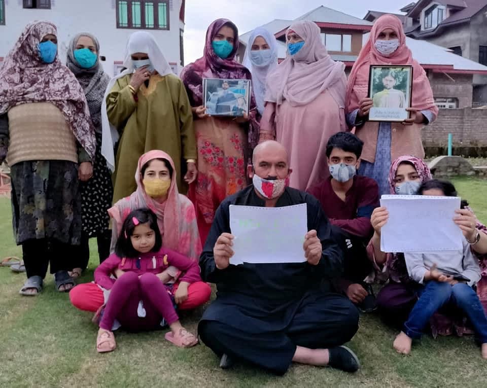 Human rights activist Mohammad Ahsan Untoo, who spent almost a year in jail, stages a protest in Srinagar with the relatives of jailed prisoners of Kashmir.