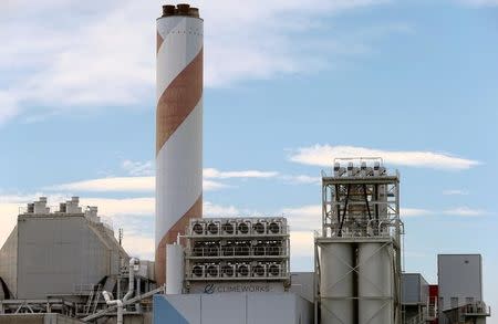 A facility for capturing CO2 from air of Swiss Climeworks AG is placed on the roof of a waste incinerating plant in Hinwil, Switzerland July 18, 2017. Picture taken July 18, 2017. REUTERS/Arnd Wiegmann