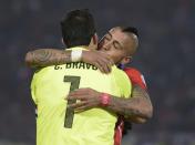 Chile's goalkeeper Claudio Bravo and midfielder Arturo Vidal celebrate after defeating Argentina to win the Copa America football championship, in Santiago, on July 4, 2015