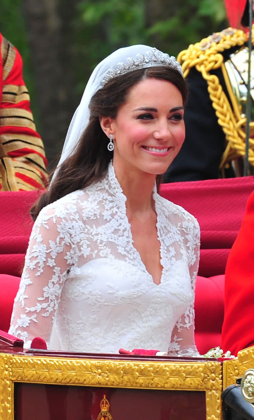 <p>How much does Kate love a half-up look? Though an updo is considered classic wedding hair, Kate broke the mold with this half-up style for her big day in 2011, accenting the look with <a href="https://www.townandcountrymag.com/society/tradition/g26533742/kate-middleton-tiara-moments/" rel="nofollow noopener" target="_blank" data-ylk="slk:the Cartier Halo Tiara;elm:context_link;itc:0;sec:content-canvas" class="link ">the Cartier Halo Tiara</a> she borrowed for the occasion from Queen Elizabeth.</p>