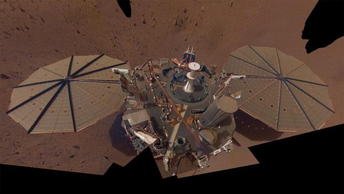 nasa insight lander dusty robot platform with two octagon solar panels on mars