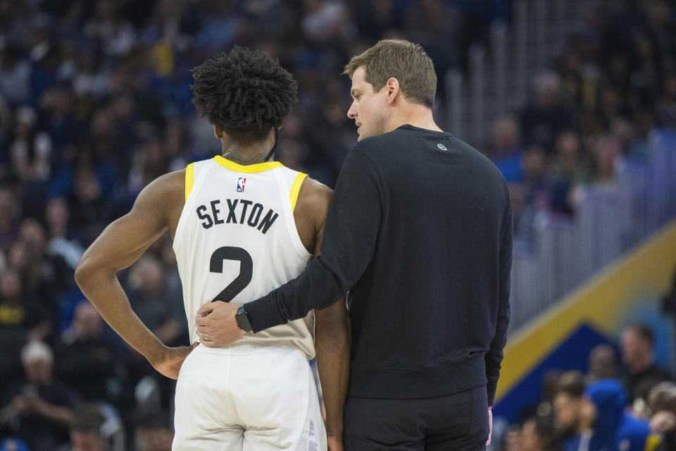 Utah Jazz head coach Will Hardy, right, talks to guard Collin Sexton (2) during the first half of an NBA basketball game against the Golden State Warriors, Sunday, April 7, 2024, in San Francisco. (AP Photo/Nic Coury)