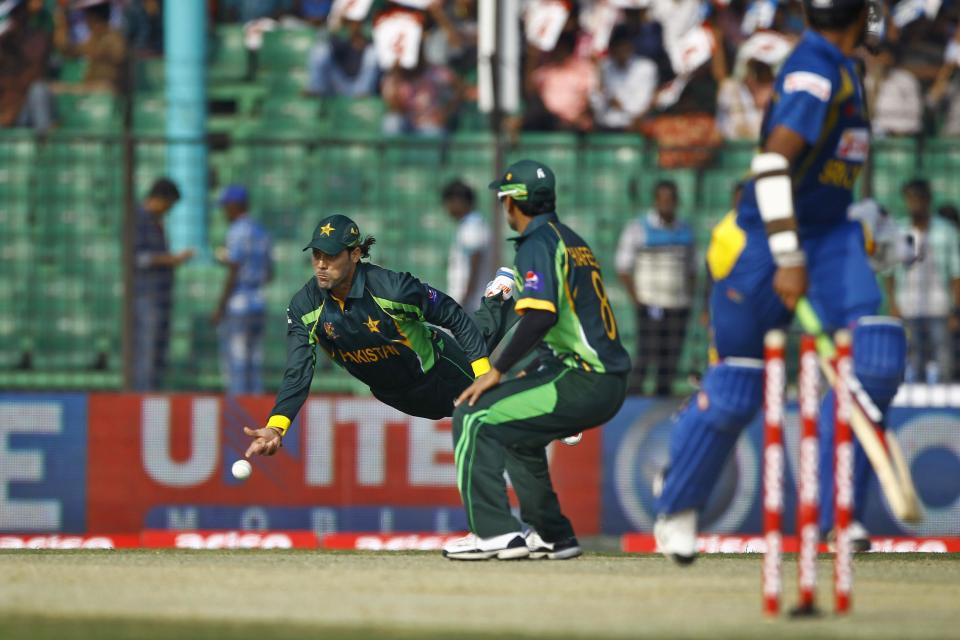 Pakistan’s Anwar Ali, left, throws the ball as he fields during the opening match of the Asia Cup one-day international cricket tournament against Sri Lanka in Fatullah, near Dhaka, Bangladesh, Tuesday, Feb. 25, 2014. (AP Photo/A.M. Ahad)