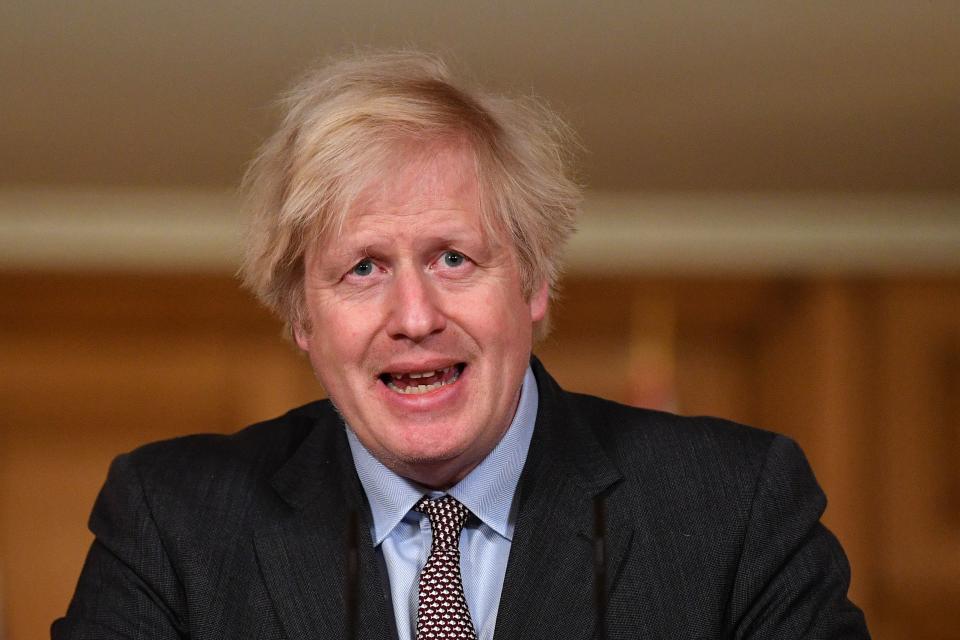 Britain's Prime Minister Boris Johnson speaks during a virtual press conference on the Covid-19 pandemic, inside 10 Downing Street in central London on January 26, 2021. - More than 100,000 people who tested positive for coronavirus have died in Britian since the pandemic took hold last year, official data showed on January 26. (Photo by JUSTIN TALLIS / POOL / AFP) (Photo by JUSTIN TALLIS/POOL/AFP via Getty Images)