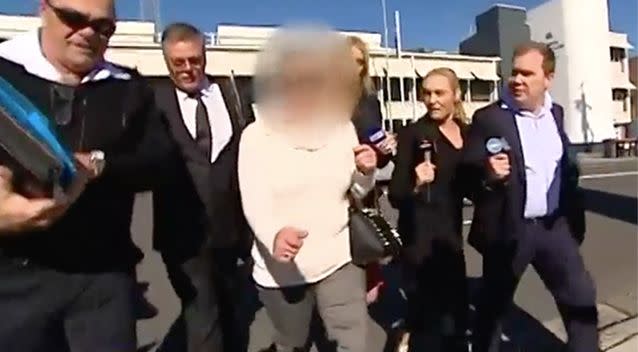 The mother, who can not be identified, leaving court today. Photo: 7 News