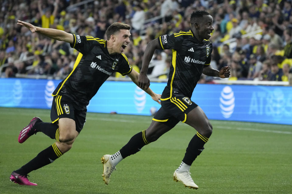 Columbus Crew midfielder Yaw Yeboah, right, celebrates after his goal with defender Malte Amundsen, left, during the first half of an MLS soccer match against Nashville SC, Sunday, May 28, 2023, in Nashville, Tenn. (AP Photo/George Walker IV)