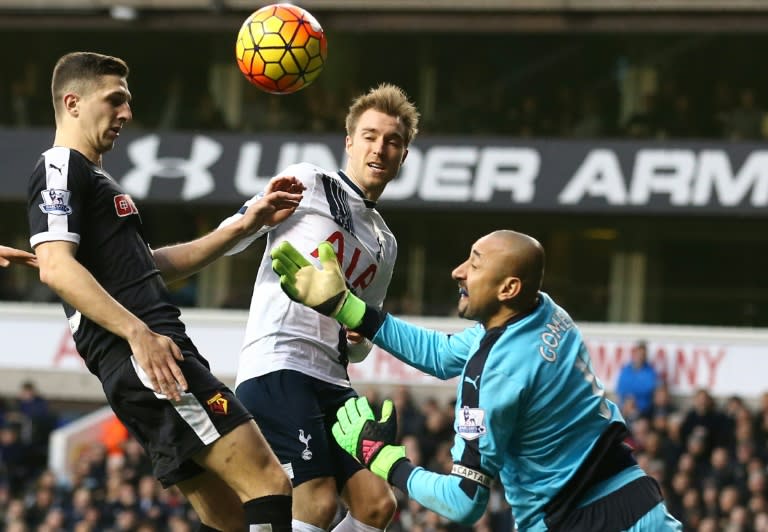 Watford's goalkeeper Heurelho Gomes (R) saves a shot during the English Premier League football match between Tottenham Hotspur and Watford in north London on February 6, 2016