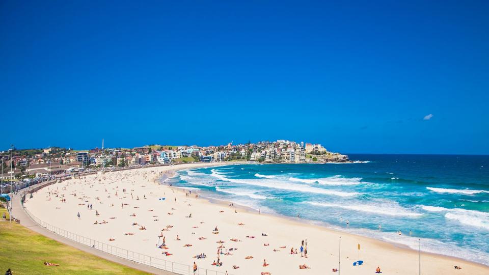 people relaxing on the bondi beach in sydney, australia