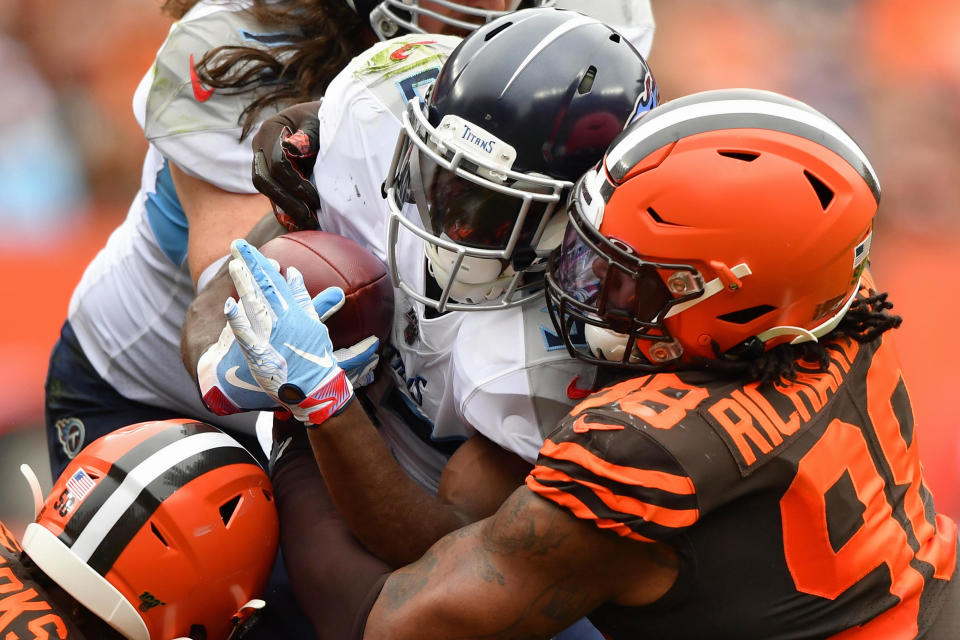 Dion Lewis #33 of the Tennessee Titans is met at the line of scrimmage by Sheldon Richardson #98 of the Cleveland Browns in the first quarter at FirstEnergy Stadium on September 08, 2019 in Cleveland, Ohio. (Photo by Jamie Sabau/Getty Images)