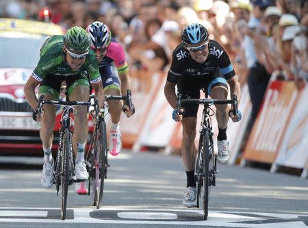 Europcar team rider Thomas Voeckler (L) of France and Team Sky rider Vasil Kiryienka of Belarus sprint to the finish line of the 237.5km 16th stage of the Tour de France cycling race between Carcassonne and Bagneres-de-Luchon, July 22, 2014. REUTERS/Christian Hartmann