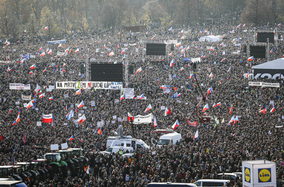 People take part in a large anti-government protest in Prague, Czech Republic, Saturday, Nov. 16, 2019. Czechs are rallying in big numbers to use the 30th anniversary of the pro-democratic Velvet Revolution and urge Prime Minister Andrej Babis to resign as peaceful protesters from all corners of the Czech Republic are attending the second massive protest opposing Babis at Letna park, a site of massive gatherings that significantly contributed to the fall of communism in 1989. (AP Photo/Petr David Josek)