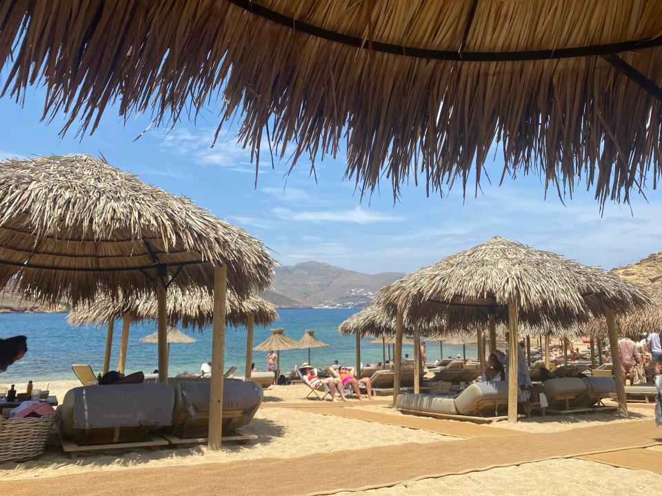 little huts set up on a beach in greece