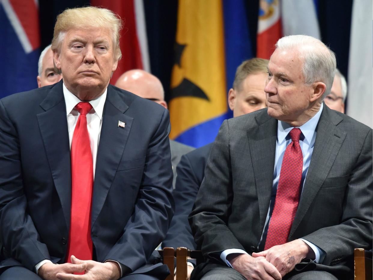 US President Donald Trump sits with Attorney General Jeff Sessions on 15 December 2017 in Quantico, Virginia: NICHOLAS KAMM/AFP/Getty Images