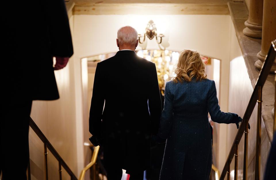 US President Joe Biden (L) and US First Lady Jill Biden walk through the Crypt of the US Capitol for the inauguration ceremony making Biden the 46th President of the United States in Washington DC on January 20, 2021. (Photo by JIM LO SCALZO / POOL / AFP) (Photo by JIM LO SCALZO/POOL/AFP via Getty Images)