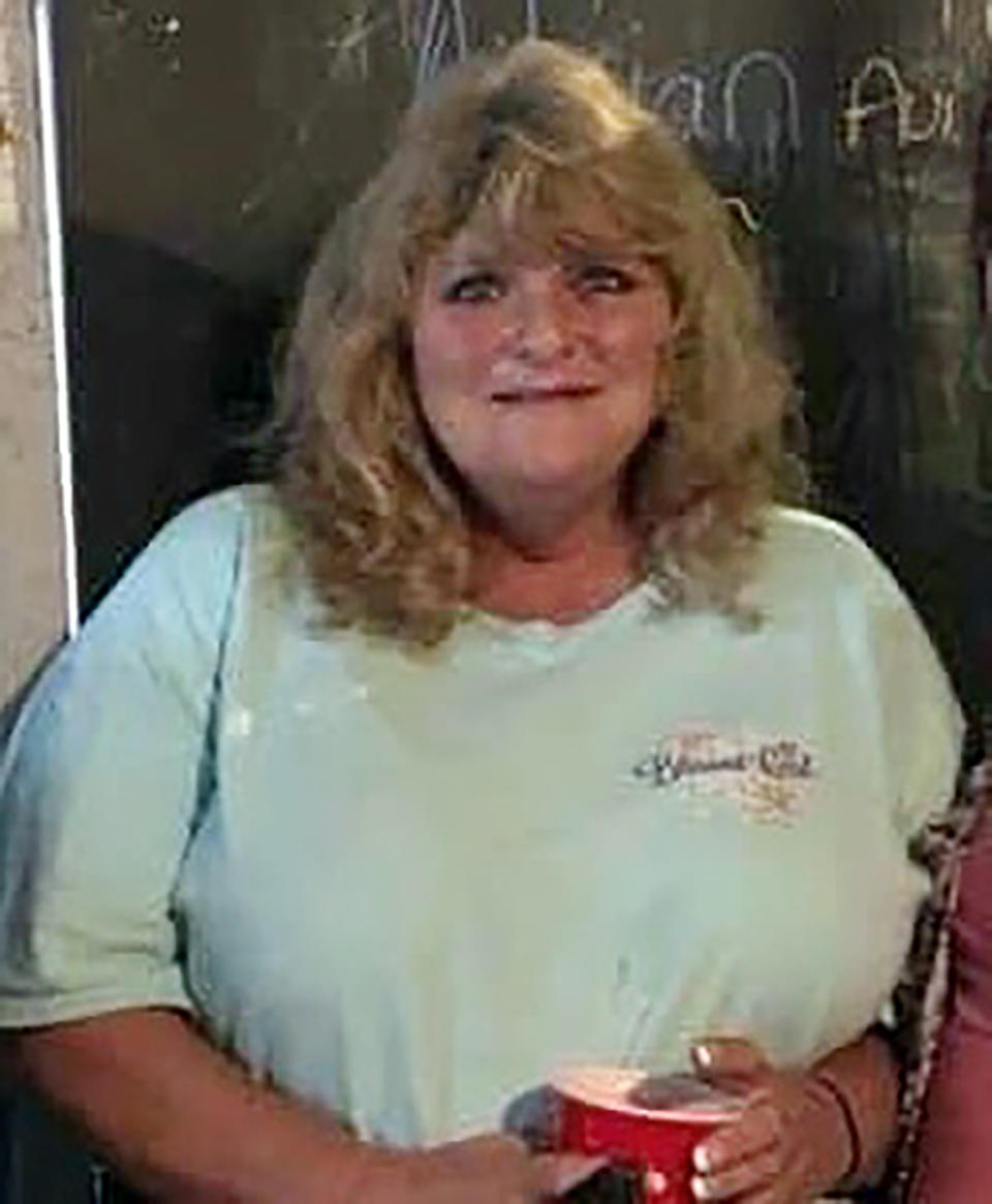 In this undated photo provided by Christie Pennington, June Pennington, assistant manager of Dollar General in Leachville, Ark., poses for a picture. June Pennington was killed in a tornado, Friday, Dec. 10, 2021. (Courtesy of Christie Pennington via AP)
