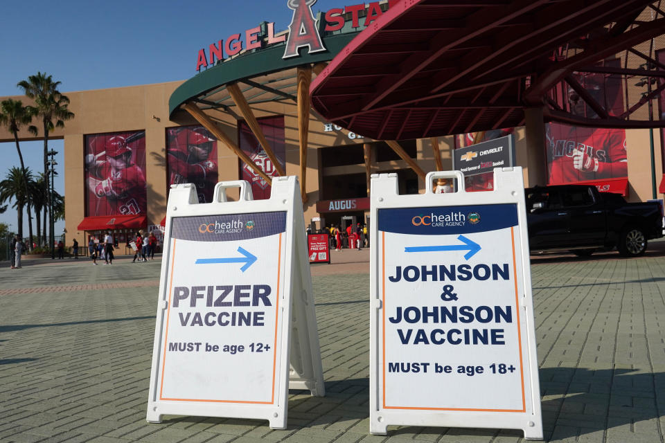 Aug 13, 2021; Anaheim, California; An OC Health Care Agency Pifizer and Moderna coronavirus COVID-19 vaccine shot sign at Angel Stadium. Mandatory Credit: Kirby Lee-USA TODAY Sports