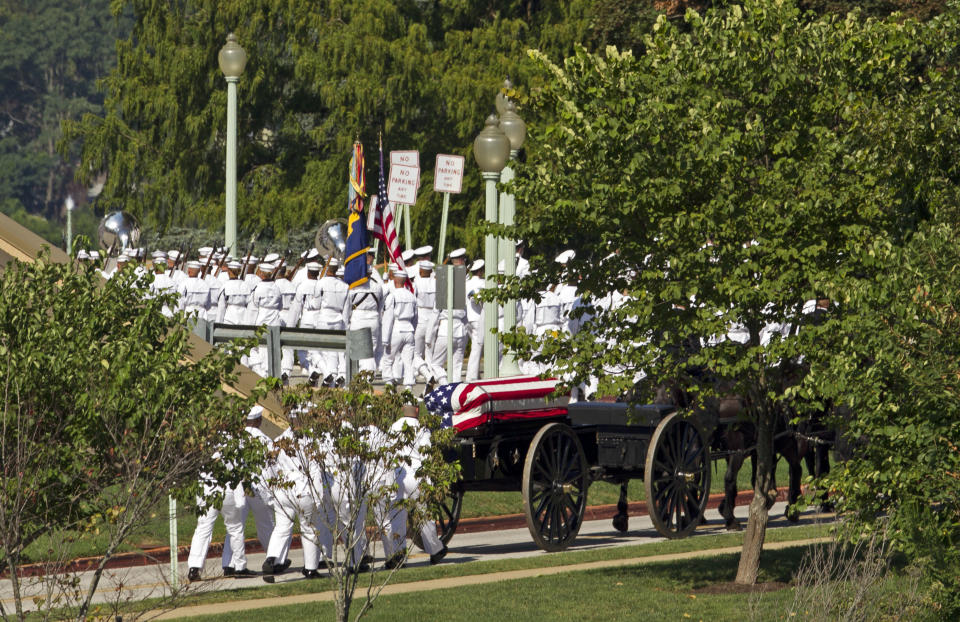 A horse drawn caisson carries the casket containing the remains of Sen. John McCain, R-Ariz., to his burial sight at the United States Naval Academy Cemetery in Annapolis Md., Sunday, Sep. 2, 2018. McCain died Aug. 25 from brain cancer at age 81. (AP Photo/Jose Luis Magana)