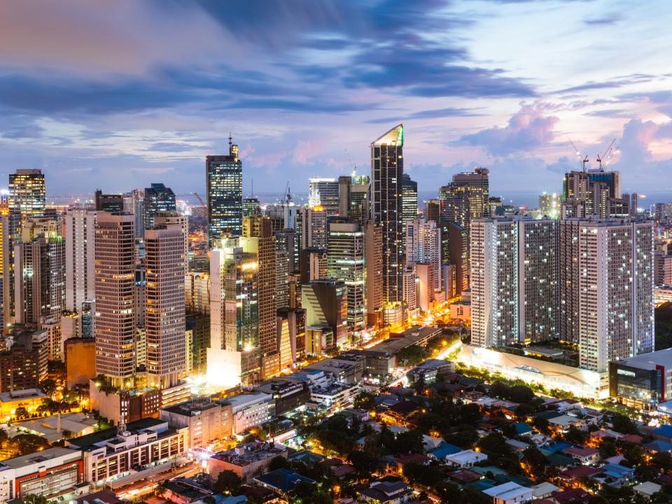 Makati skyline at dusk, Manila, Philippines - stock photo