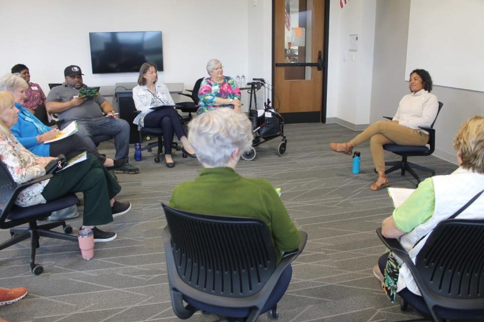 Francoise Long, center right, was one of the human books at the Human Library event on Sunday at Santa Fe College's Blount Hall. Her human book was titled "Design Without a Mold."
(Photo: Photo by Voleer Thomas/For The Guardian)