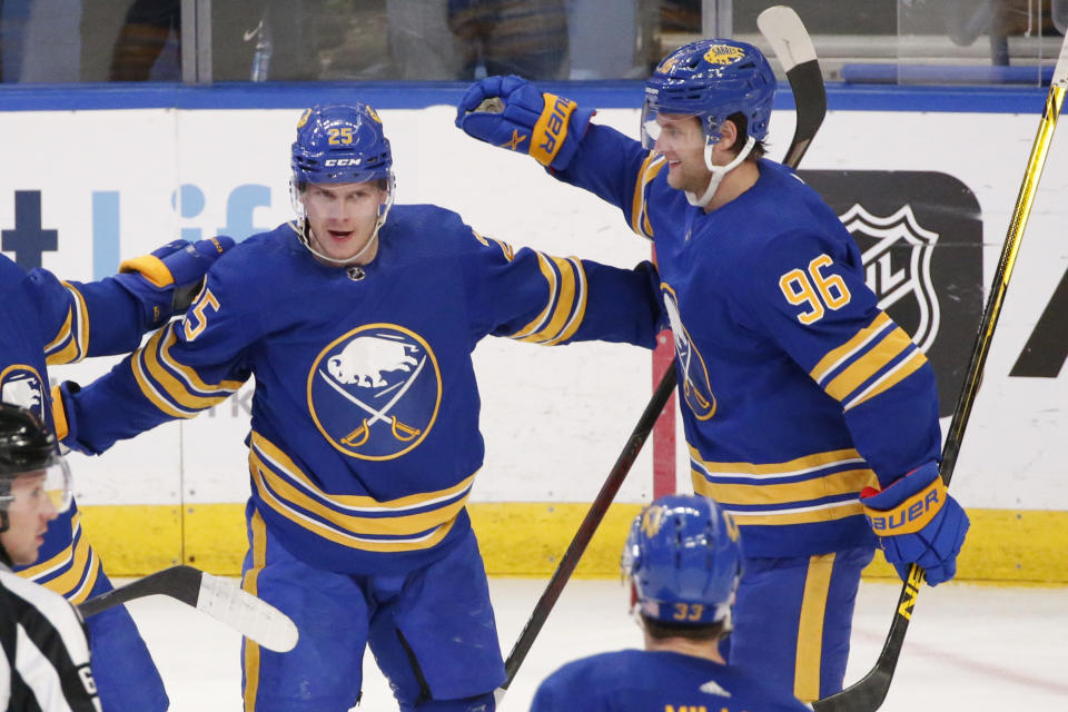 Buffalo Sabres center Arttu Ruotsalainen (25) celebrates his goal with left wing Anders Bjork (96) during the third period of an NHL hockey game against the Detroit Red Wings, Saturday, Nov. 6, 2021, in Buffalo, N.Y. (AP Photo/Jeffrey T. Barnes)